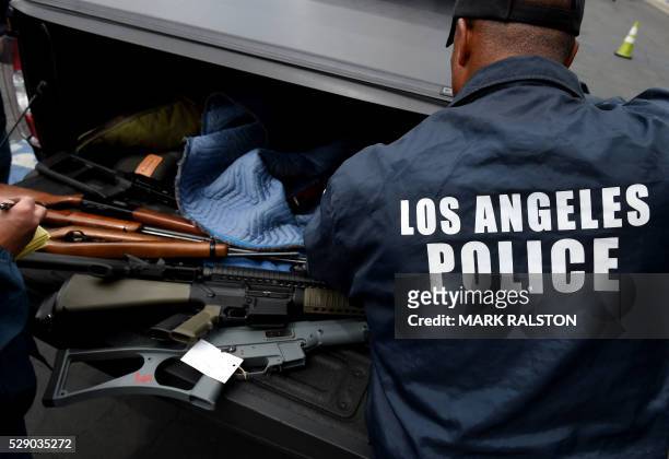 Rifles and assault rifles among a batch of thirteen that were exchanged for gift cards are seen during a Los Angeles Police Department and Mayor's...