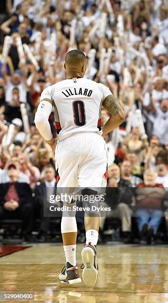 Damian Lillard of the Portland Trail Blazers heads back down court after hitting a three point shot late in the fourth quarter of Game Three of the...
