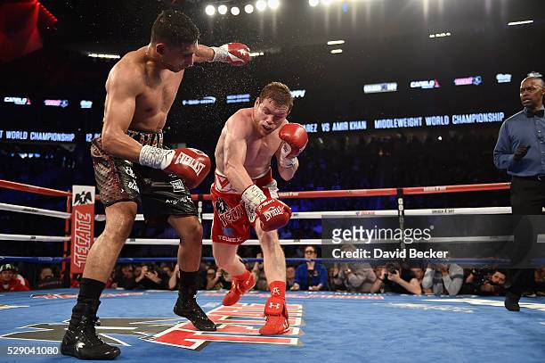 Canelo Alvarez throws a right at Amir Khan during the WBC middleweight title fight at T-Mobile Arena on May 7, 2016 in Las Vegas, Nevada.