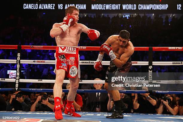 Canelo Alvarez throws a left at Amir Khan during the WBC middleweight title fight at T-Mobile Arena on May 7, 2016 in Las Vegas, Nevada.