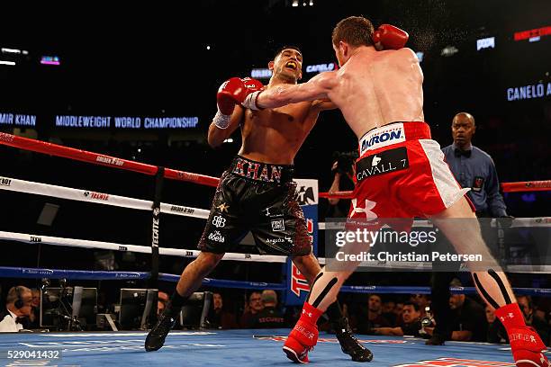 Canelo Alvarez throws a right at Amir Khan during the WBC middleweight title fight at T-Mobile Arena on May 7, 2016 in Las Vegas, Nevada.