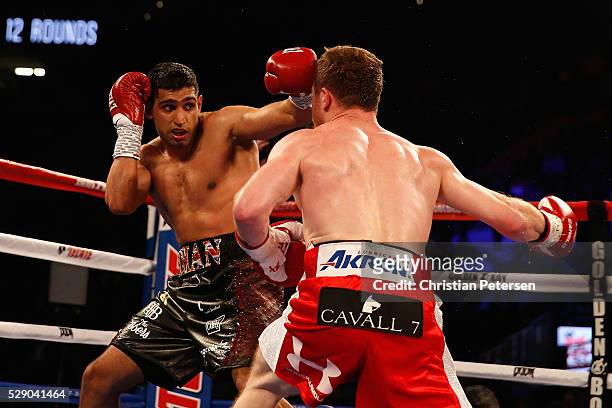 Amir Khan throws a left at Canelo Alvarez during the WBC middleweight title fight at T-Mobile Arena on May 7, 2016 in Las Vegas, Nevada.