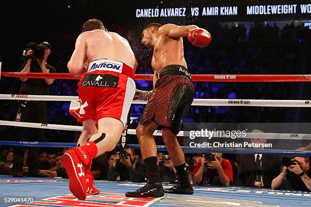 Canelo Alvarez throws a knockout punch at Amir Khan during the WBC middleweight title fight at T-Mobile Arena on May 7, 2016 in Las Vegas, Nevada.