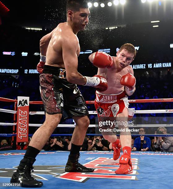 Canelo Alvarez delivers the knockout punch to Amir Khan during the sixth round of their WBC middleweight title fight at T-Mobile Arena on May 7, 2016...