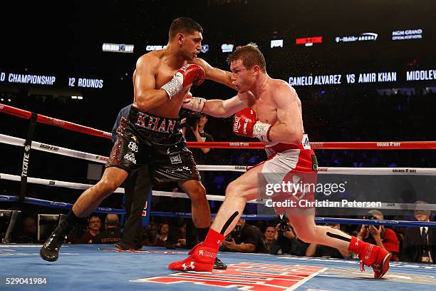 Canelo Alvarez throws a right at Amir Khan during the WBC middleweight title fight at T-Mobile Arena on May 7, 2016 in Las Vegas, Nevada.