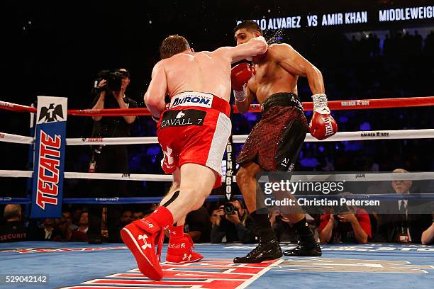 Canelo Alvarez throws a right at Amir Khan during the WBC middleweight title fight at T-Mobile Arena on May 7, 2016 in Las Vegas, Nevada.