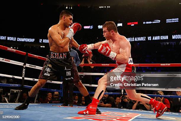 Canelo Alvarez throws a right at Amir Khan during the WBC middleweight title fight at T-Mobile Arena on May 7, 2016 in Las Vegas, Nevada.