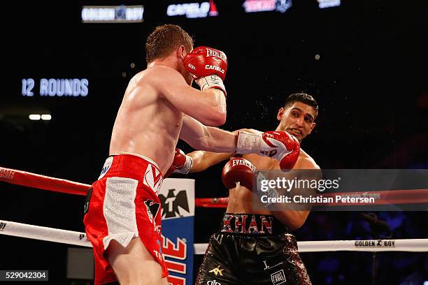 Canelo Alvarez throws a left at Amir Khan during the WBC middleweight title fight at T-Mobile Arena on May 7, 2016 in Las Vegas, Nevada.