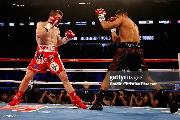 Amir Khan looks to strike Canelo Alvarez during the WBC middleweight title fight at T-Mobile Arena on May 7, 2016 in Las Vegas, Nevada.