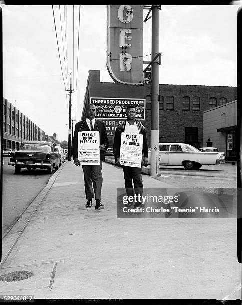 Greater Pittsburgh Improvement League members William 'Billy' Roberson and Melvin Garth holding signs reading 'Please! Do Not Patronize Kroger's...we...