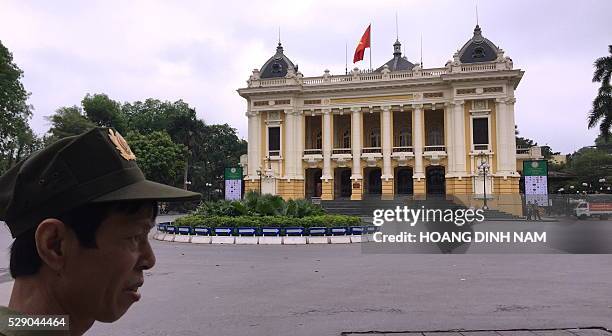 Local militia member stands guard at the unusual empty Opera House's square where protesters initially planned an anti-Formosa rally after a heavy...