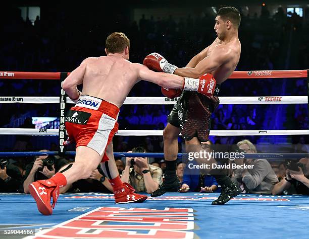 Canelo Alvarez connects with Amir Khan during a WBC middleweight title fight at T-Mobile Arena on May 7, 2016 in Las Vegas, Nevada. Alvarez won by a...