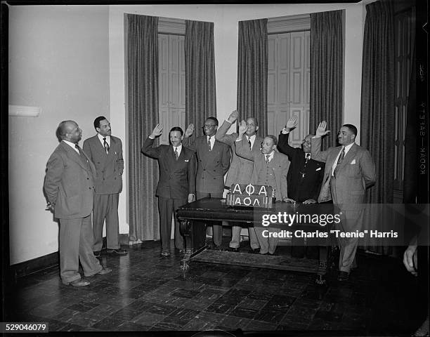 Alpha Phi Alpha members, from left: Atty. A. D. Stevenson and Alexander Allen, with officers swearing oaths: George Mason, H. D. McCullough, Dr. R....