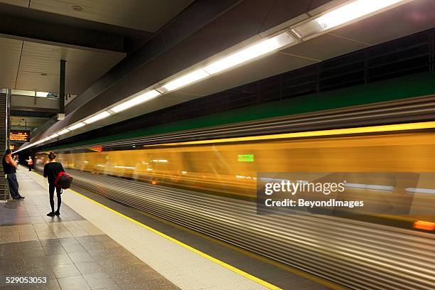 transperth electric train service departs perth underground station - perth australia stock pictures, royalty-free photos & images