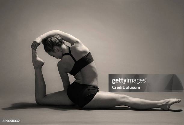 young woman stretching - contortionist stock pictures, royalty-free photos & images