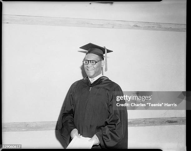 Group portrait of University of Pittsburgh School of Law graduate K. Leroy Irvis, posed in Cathedral of Learning, Pittsburgh, Pennsylvania, June 1954.