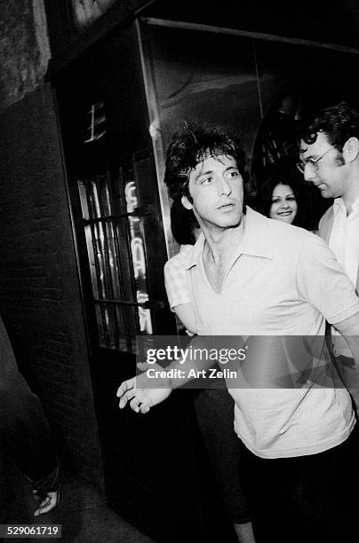 Al Pacino coming out onto the street; circa 1970; New York