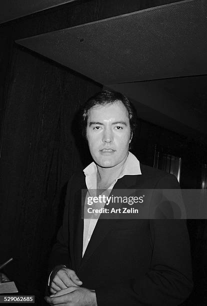 Powers Boothe wearing a suit jacket and open collar; circa 1960; New York.