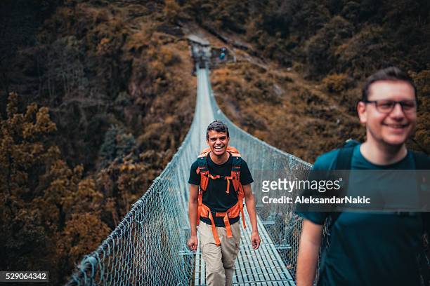 over the footbridge - glimpses of daily life in nepal stock pictures, royalty-free photos & images
