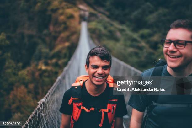 over the footbridge - glimpses of daily life in nepal stock pictures, royalty-free photos & images