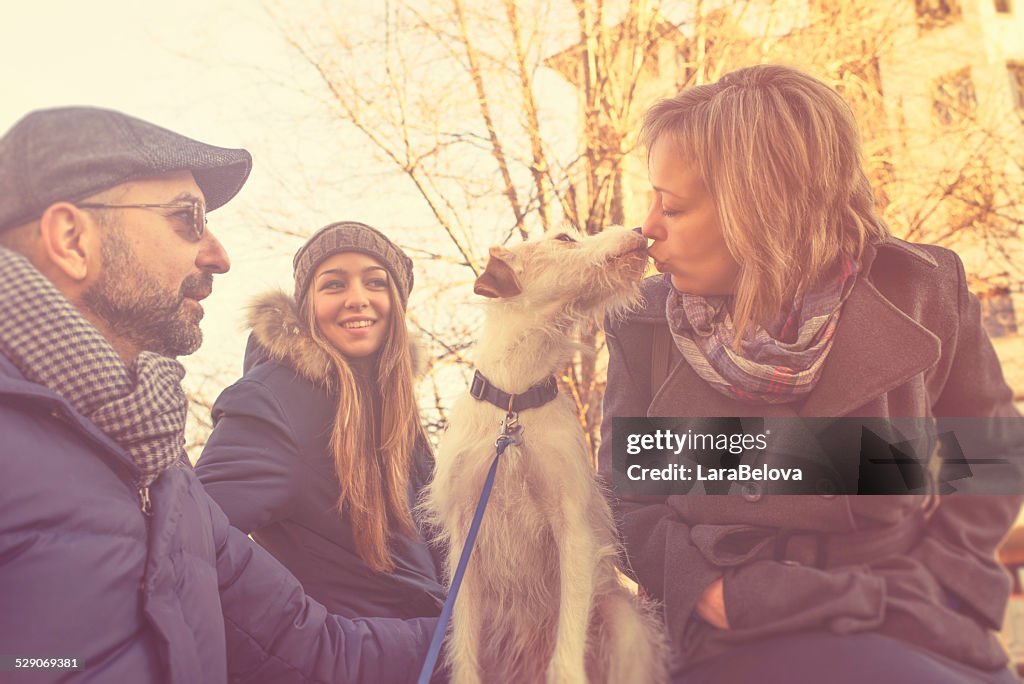 Real family with adopted by them dog