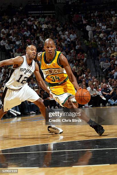 Ray Allen of the Seattle SuperSonics drives past Bruce Bowen of the San Antonio Spurs in Game five of the Western Conference Semifinals during the...