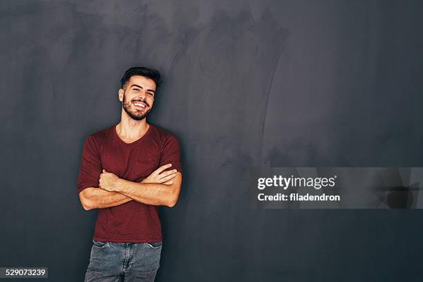 young man in front of blackboard - portrait of teacher and student bildbanksfoton och bilder