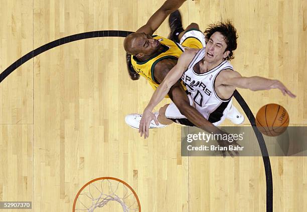 Manu Ginobili of the San Antonio Spurs gets flattened by Damien Wilkins of the Seattle SuperSonics for a flagrant foul in Game five of the Western...