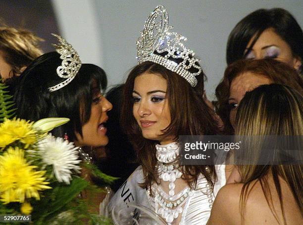 Miss Egypt 2004 Heba El-Sisy congratulates Miriam George after her crowning late 19 April 2005 in Cairo. AFP PHOTO/-