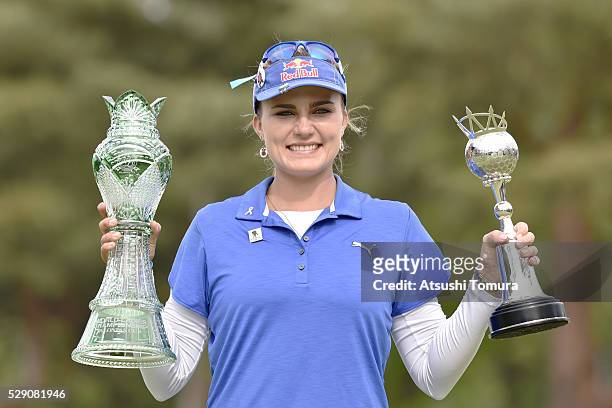 Lexi Thompson of the USA poses with trophies after winning the World Ladies Championship Salonpas Cup at the Ibaraki Golf Club on May 8, 2016 in...