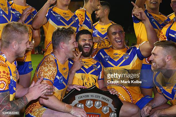 Aaron Gray, Chris Lawrence, Josh Mansour, Leilani Latu and Bryce Cartwright of City celebrate with the shield after victory during the NSW Origin...