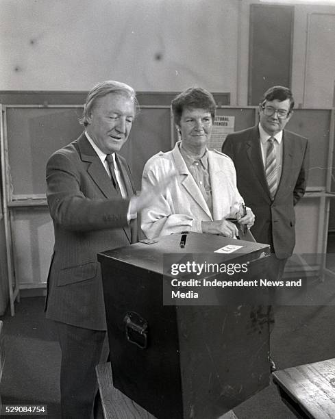 Fianna Fail leader Charles Haughey TD and his wife Maureen cast their votes in the Divorce Referendum at Kinsealy NS, looking on is Ray Burke TD...