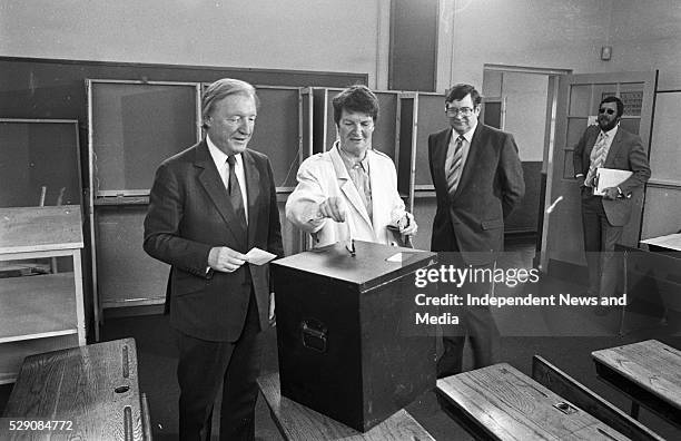 Fianna Fail leader Charles Haughey,TD and his wife Maureen cast their votes in the Divorce Referendum at Kinsealy NS, looking on is Ray Burke TD....