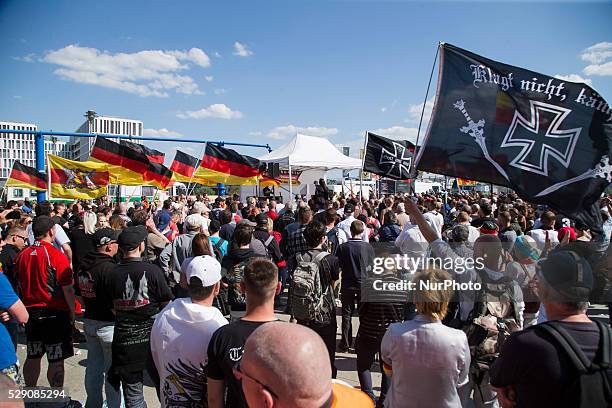 Right-wing activists hold banners and scream slogans during a demonstration to protest under the motto 'Merkel must go' against German Chancellor...