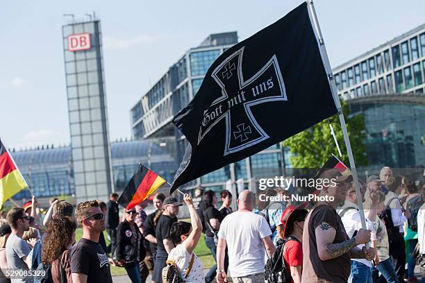Small group of people protest as right-wing activists march in front of the Chancellery during a demonstration organised under the motto 'Merkel must...