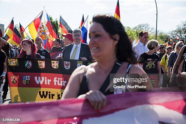 Right-wing activists march in the city center during a demonstration organised under the motto 'Merkel must go' to protest against German Chancellor...