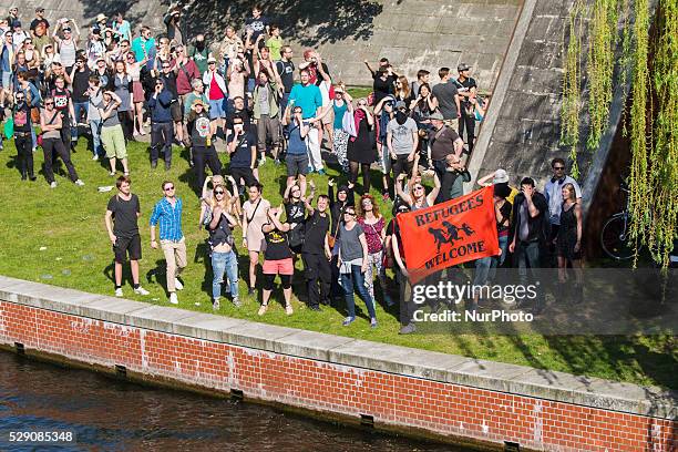 Left-wing activists protest as right-wing activists march in the city center during a demonstration organised under the motto 'Merkel must go' to...