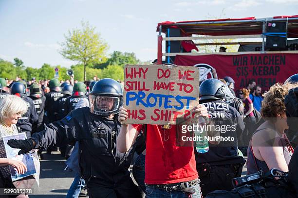 Protester holds a banner reading 'why do we still have to protest this shit?' during a demonstration organised from left-wing activists while...