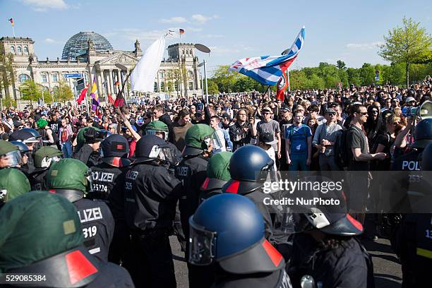 Protester holds a white flag during a demonstration organised from left-wing activists while right-wing activists and Neo-Nazis march in the city...