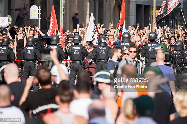 Left-wing activists protest while right-wing activists and Neo-Nazis march in the city center to demonstrate under the motto 'Merkel must go' against...