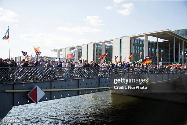 Right-wing activists march in the city center during a demonstration organised under the motto 'Merkel must go' to protest against German Chancellor...