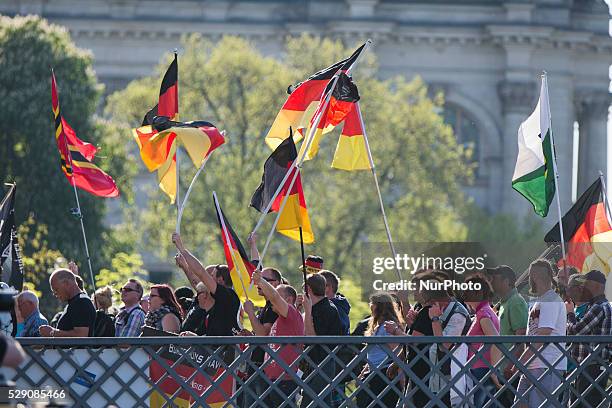 Right-wing activists and neo-nazis march in the city center during a demonstration organised under the motto 'Merkel must go' to protest against...