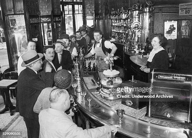 An interior view of patrons at the bar in the Cafe Gourand in the Montmartre district, Paris, France, 1935.