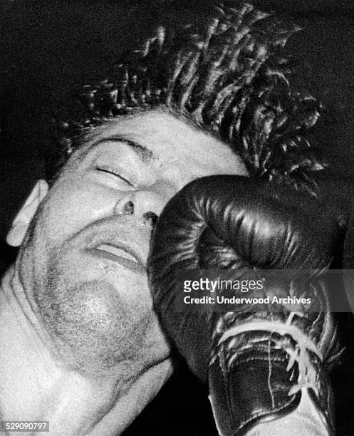 Joey Klein takes a right uppercut from the glove of Jed Black in their ten round welterweight fight at St Nicholas Arena, New York, New York, April...