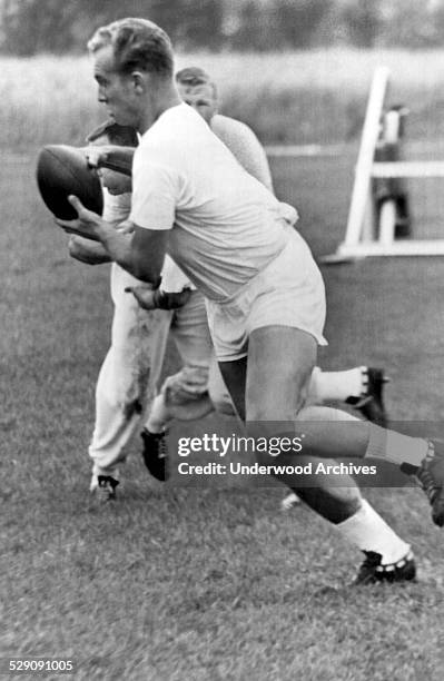 Green Bay Packer halfback Paul Hornung works himself into shape with two a day drills at the Packer camp, Green Bay, Wisconsin, July 27, 1962.