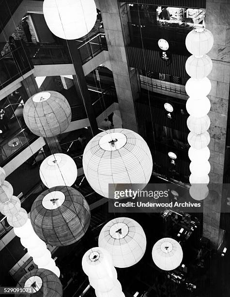 Paper lanterns on display in the six story atrium of a department store in honor of the birth of their first son to Japanese Crown Prince Akihito and...