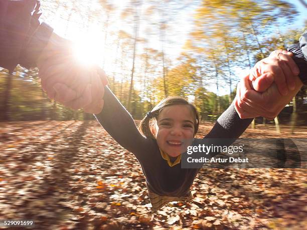 girl spin holding hand to dad on pov autumn view. - wide angle stockfoto's en -beelden