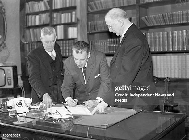 Taoiseach Mr Sean Lemass and President DeValera signing the proclamation to dissolve Dail Eireann, .