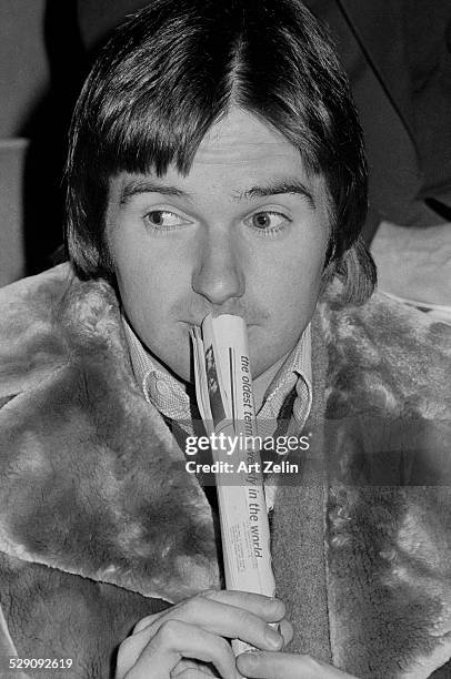 Jimmy Connors with tennis paper; circa 1970; New York.