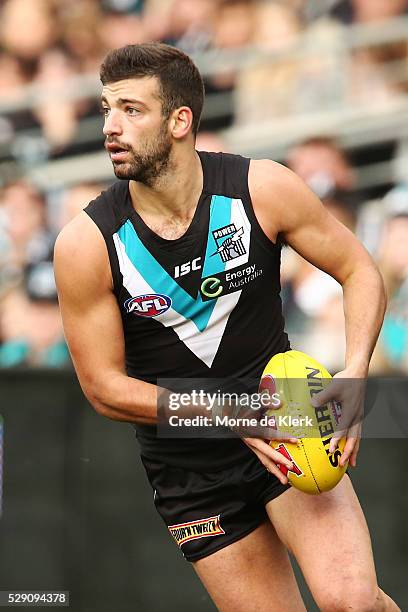 Jimmy Toumpas of the Power runs with the ball during the round seven AFL match between the Port Adelaide Power and the Brisbane Lions at Adelaide...